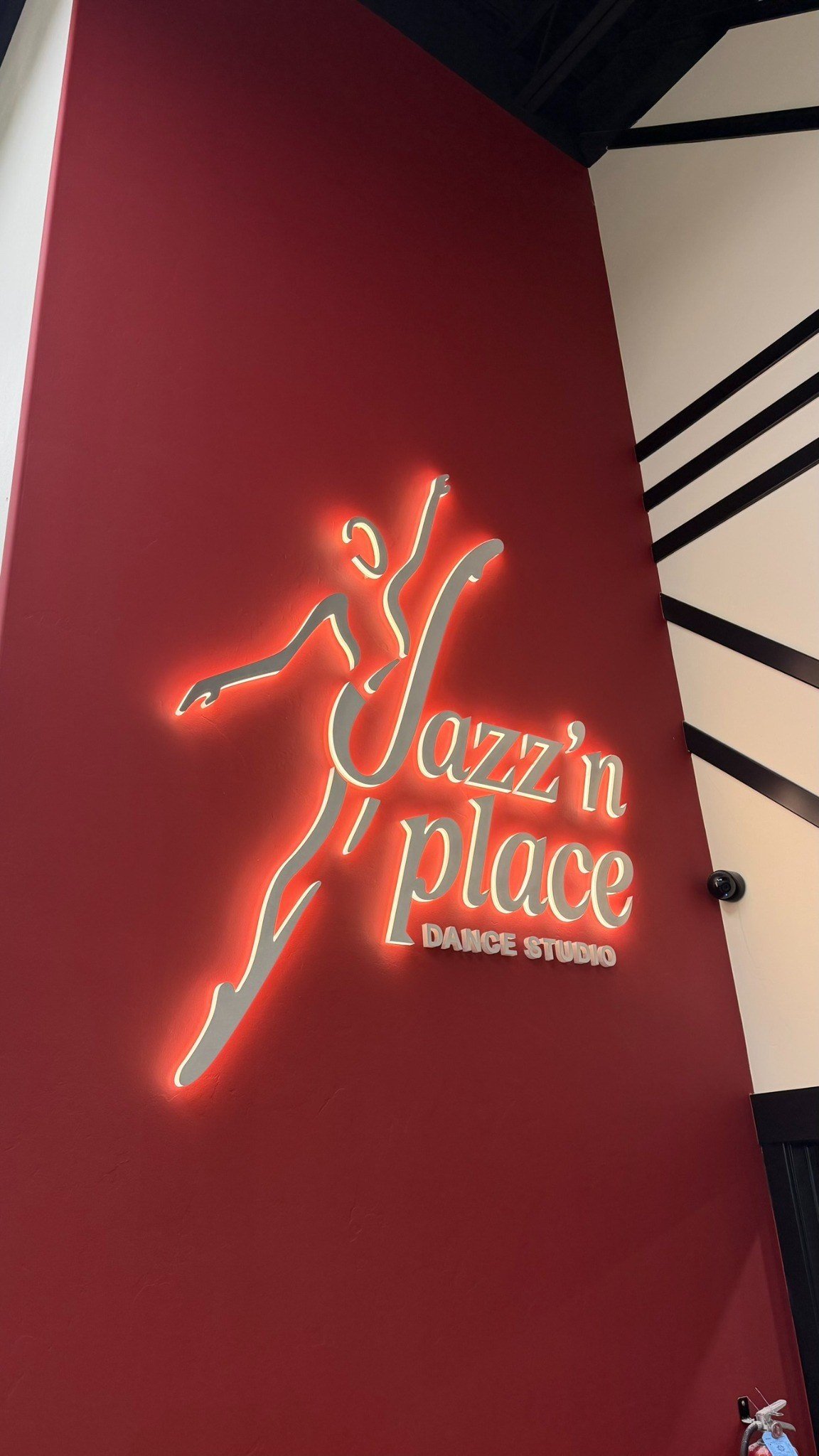 Lobby halo-lit sign at Jazz’n Place dance studio